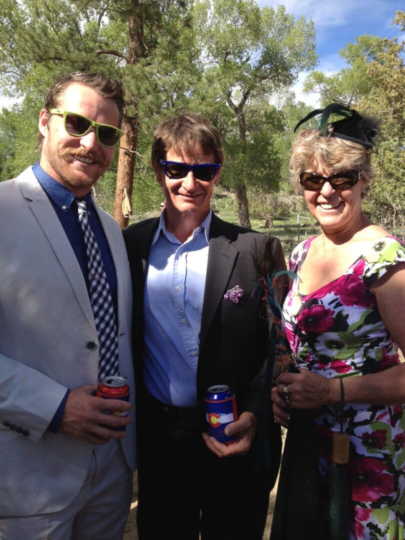 Nick, Pat, and Carmen at a wedding
