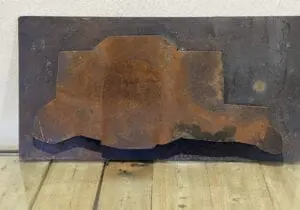 Relief Light Sconce in Rusted Steel