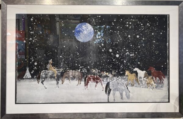 A framed painting of "Astral Horses" in the snowy landscape by Taos.